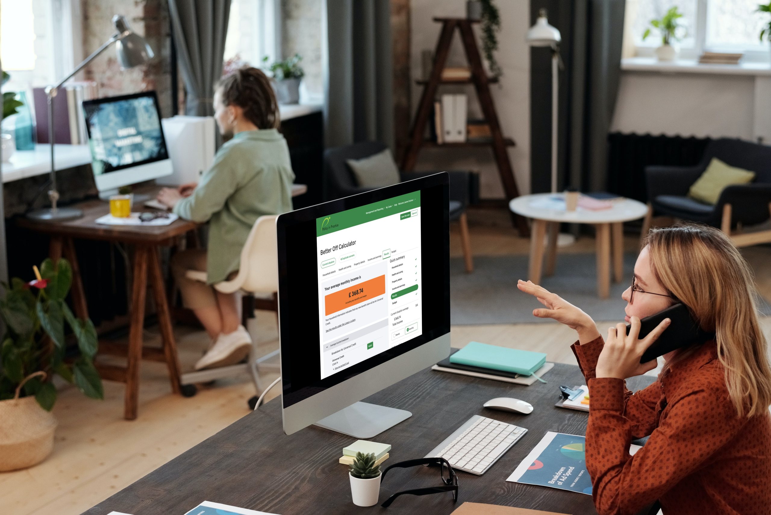 Woman looking at screen of the calculator